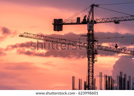 silhouette construction crane on dramatic sky background