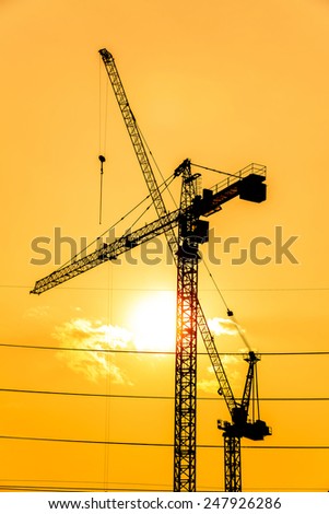 Similar – The sun sets and the cranes rise