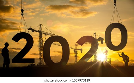 Silhouette construction site,Cranes building construction 2020 year sign - Shutterstock ID 1559973119