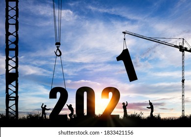 Silhouette of construction worker with crane under prepare welcome 2021 new year party and change new business.