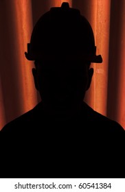 Silhouette of construction worker with hardhat