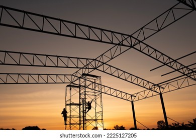 Silhouette  Construction Worker Working On Scaffolding In Industrial Construction During Sunset Sky Background Over Time Job