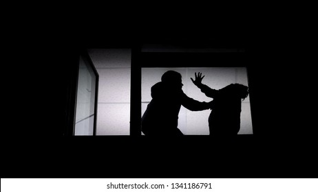 Silhouette Of Couple Arguing, Man Beating Helpless Woman, Domestic Violence