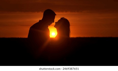 Silhouette of a couple in love in glamor romance at sunset. Love story concept. - Powered by Shutterstock