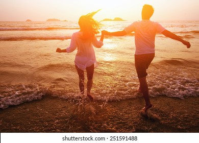 silhouette of couple on the beach, dream vacations