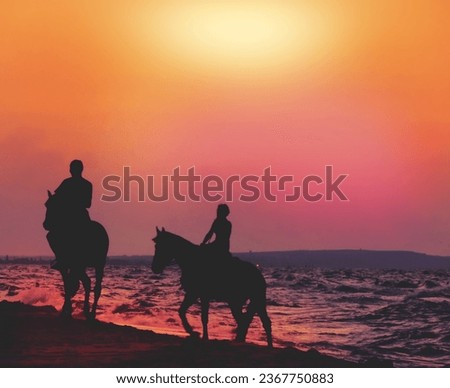 Silhouette of couple riding  horses, romantic walking, honeymoon.  Amazing sunset on the beach        