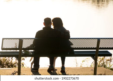 Silhouette Couple Sitting On Bench During Stock Photo 1902273670 ...