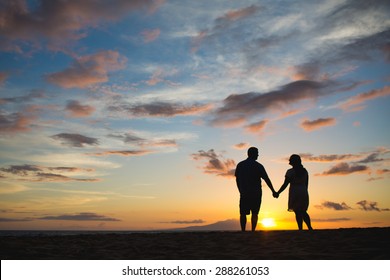 Silhouette Of Couple With A Sunset