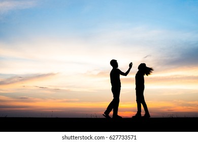 Silhouette of couple upset,man and women are quarrel in sunset time. - Shutterstock ID 627733571