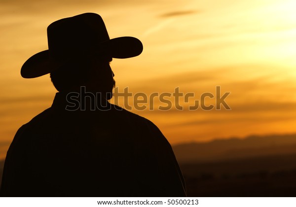 Silhouette Cowboy Backlit Against Bright Colorful Stock Photo 50500213 ...