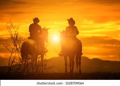   Silhouette Cowboy on horseback. Ranch