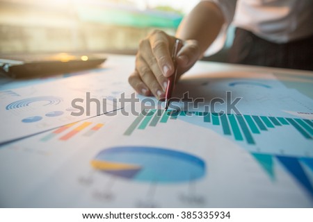 Silhouette of cropped shot of businessman hand working with new modern computer and business strategy as concept,selective focus,flare light