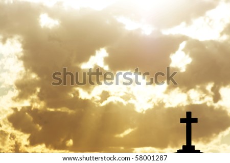 Silhouette of a cross in beams of light