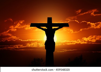 Silhouette Crucifixion Of Jesus And The Sunset.