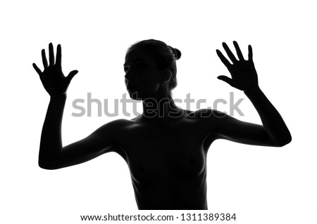 Similar – Close up front portrait of one young middle age athletic woman in sportswear in gym over dark background, standing in boxing stance with hands and fists, looking at camera