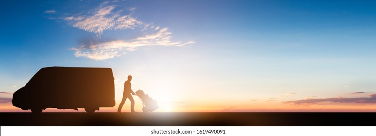 Silhouette Of Delivery Courier With Cardboard Boxes On Trolley Near The Van At Sunset - Powered by Shutterstock