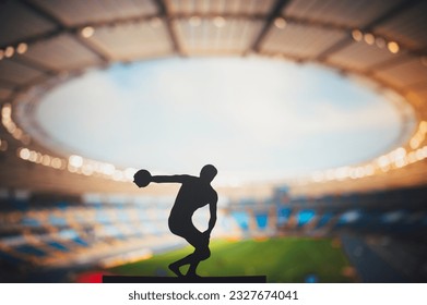 Silhouette of Discus Thrower, Showcasing Technique at Modern Stadium. Track and Field Photo for Summer Games in Paris - Powered by Shutterstock