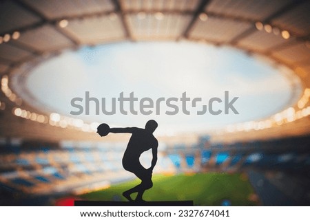 Silhouette of Discus Thrower, Showcasing Technique at Modern Stadium. Track and Field Photo for Summer Games in Paris