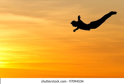 silhouette of diver in sunset