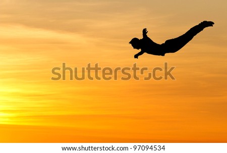 silhouette of diver in sunset