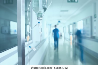 Silhouette of a doctor walking in a hurry in the hospital corridor. - Powered by Shutterstock