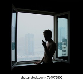 silhouette of drinking glasses men in the background of an open window