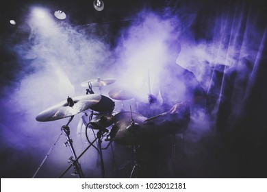 Silhouette Of Drummer / Percussion / Cymbal /drum Player Playing On Drums On A Concert . Club Lights, Fog, Smoke, Artist Show.