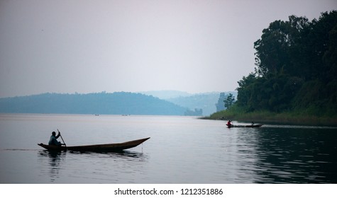 silhouette of a dug out african wooden canoe on lake kivu in Congo