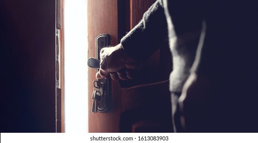 Silhouette Of An Elderly Man, Old Hands And An Open Door And Light. Concept Of Hope In Old Age