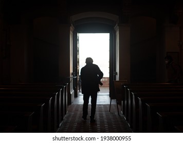 Silhouette Of An Elderly Man Standing In A Doorway. A Light And Dark Photo In Low Key. Stock Photography.