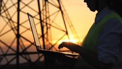 Silhouette Electrical Engineer, Work Computer Tablet Sunset, Electric Tower, Digital Hand, Studying Engineer With Electric Towers Sunset, Engineer With Tablet Works Near Electric Poles Sunset
