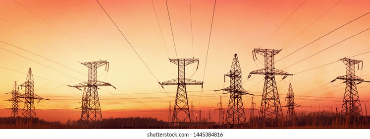Silhouette electricity pylons at sunset. This image created from multiple images  for the best quality.