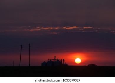 Silhouette of elevator for grain storage and processing on sunset in Bauska area, Latvia