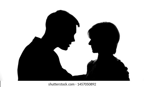 Silhouette Of Emotional Male Touching Female Shoulders, Family Quarrel, Crisis