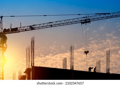 Silhouette Engineer Standing Orders Construction Crew Working On High Ground, Heavy Industry And Safety Concept Over Nature Background Pastel Sunset Blur.