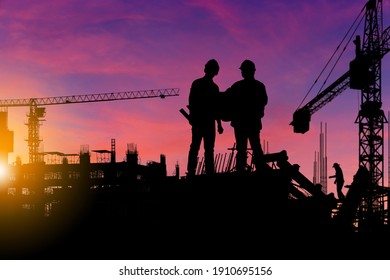 Silhouette Of Engineer And Worker Checking Project At Building Site Background, Construction Site At Sunset In Evening Time