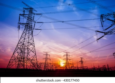 The silhouette of the evening electricity transmission pylon - Shutterstock ID 430177450