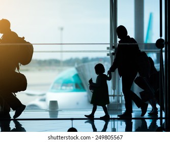 Silhouette Of Family At Airport