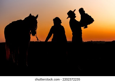 Silhouette Of Farm Family, Woman Holding Horse And Gaucho Father