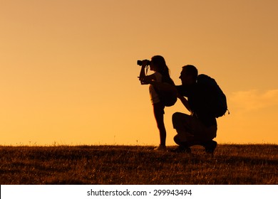 Silhouette of father and daughter hiking together.Father and daughter hiking - Powered by Shutterstock