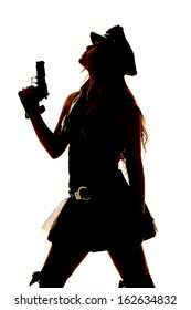 A Silhouette Of A Female Cop Holding A Gun And Looking Up.