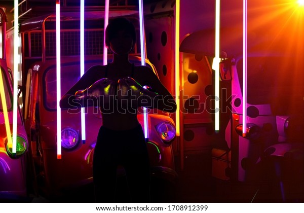 Silhouette of Fighter Boxer Woman sweat train and\
wear silver fashion gloves in Modern color Neon \
