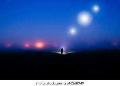 A silhouette of a figure, standing in the countryside on a foggy night, with glowing lights of UFO's in the sky