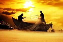 Silhouette Of Fishermen With Yellow And Orange Sun In The Background