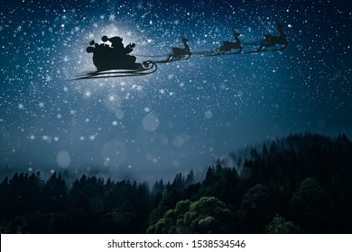 silhouette of a flying goth santa claus against the background of the night sky. - Powered by Shutterstock