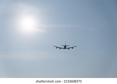 Silhouette of four engine jet taking off into the skies