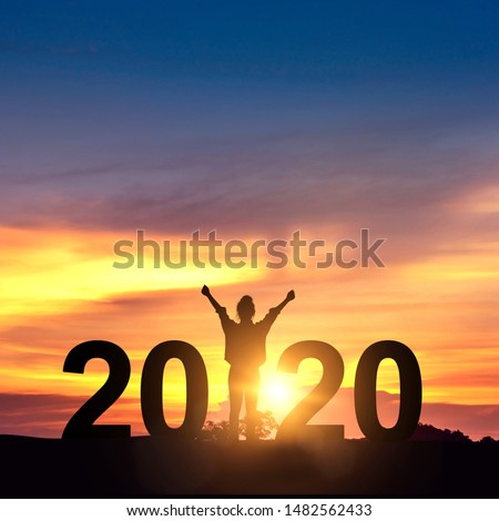 Silhouette freedom young businesswoman Enjoying on the hill and 2020 years while celebrating new year, copy space.