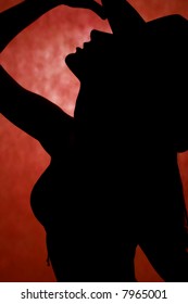 silhouette in front of red background