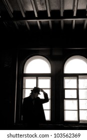 silhouette in front of the window