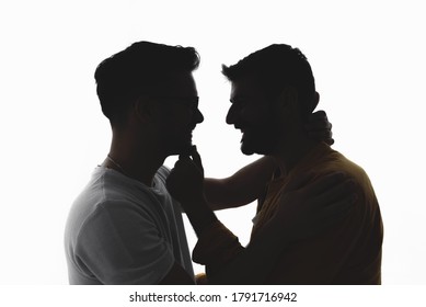 Silhouette Of Gay Couple In Love Over White Background